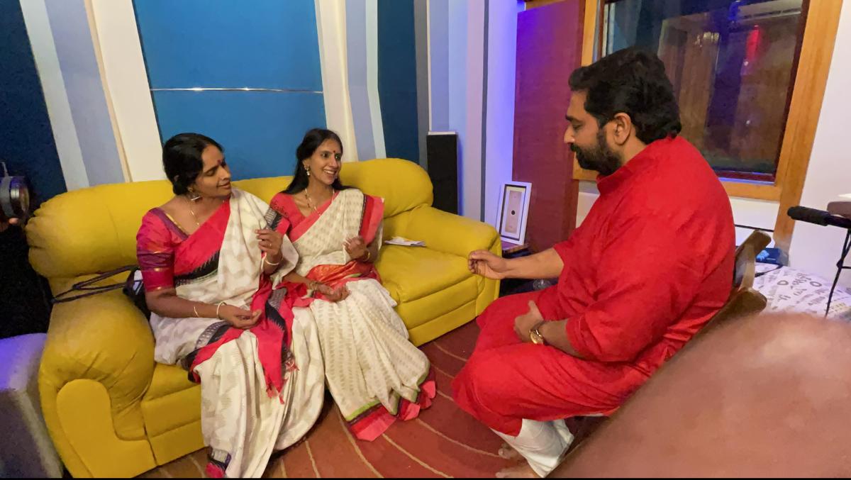 M Jayachandran with Ranjani-Gayatri duo while recording the song